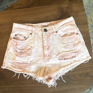 BDG UO pink acid wash distressed shorts